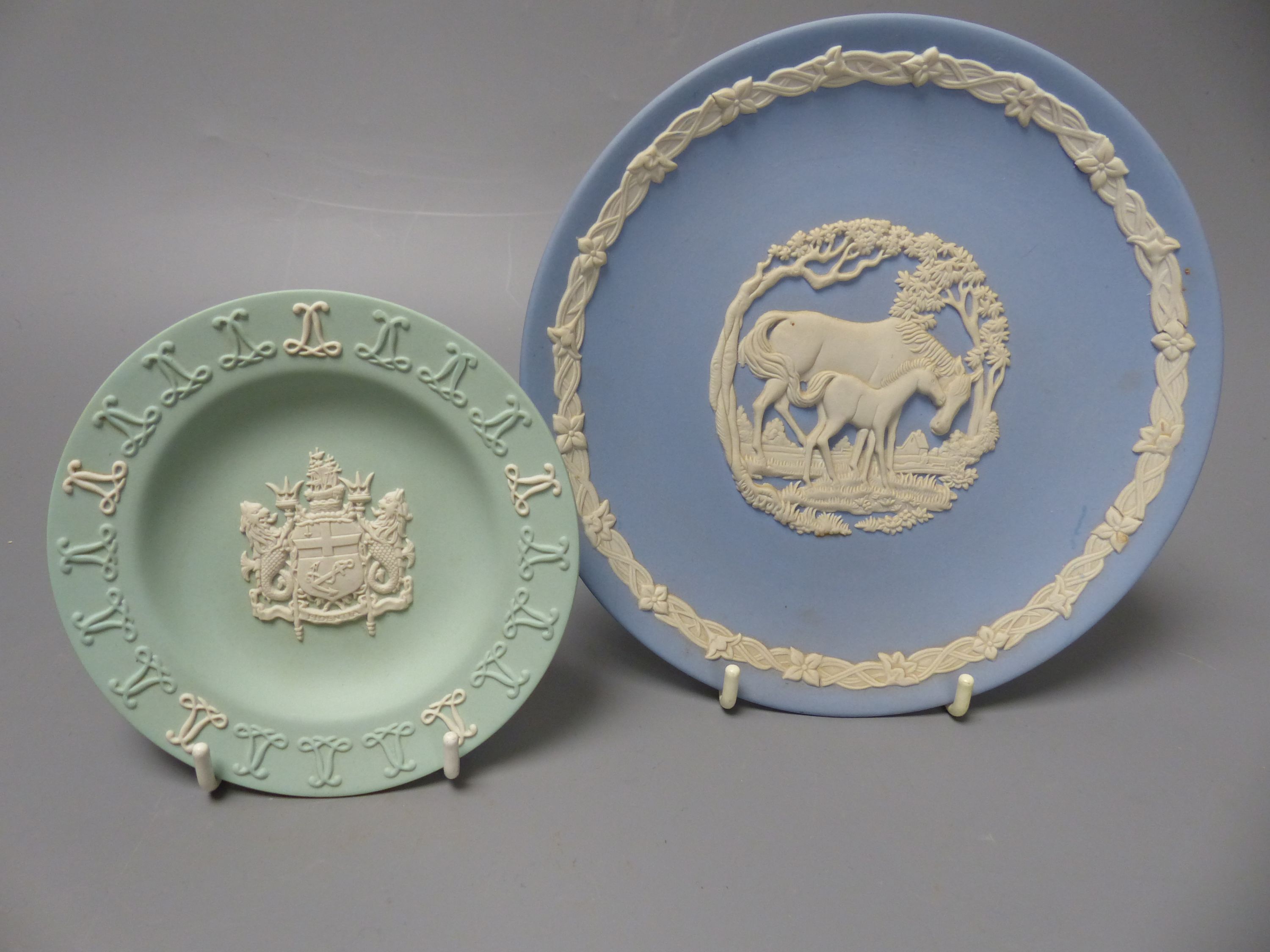 Four pieces of Wedgwood jasper wares including a pair of Victorian blue jasper vases, height 18.5cm, and later dish and pin dish